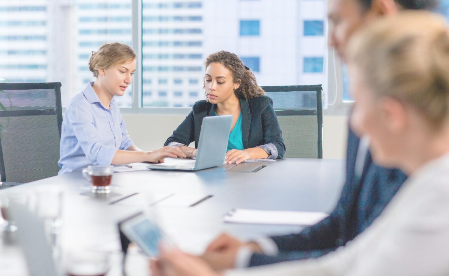 Young couple reviewing monthly expenses and savings goals together