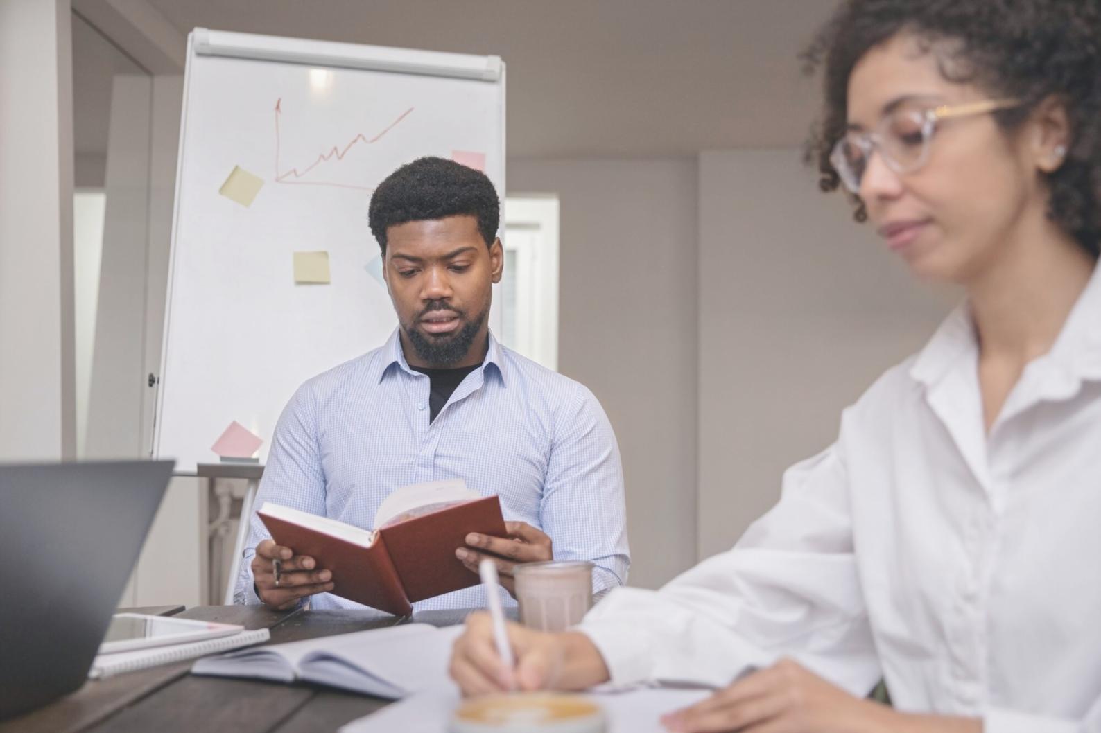 Australian family reviewing household budget together at kitchen table